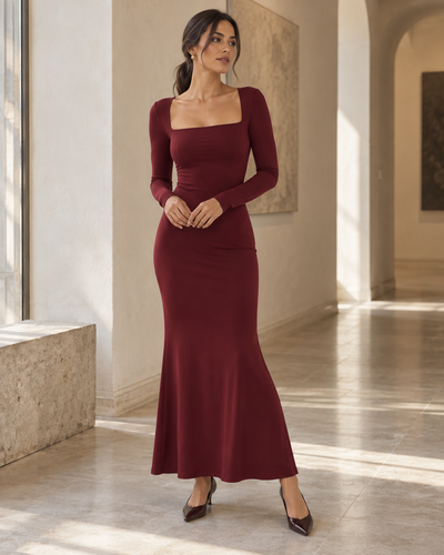 Woman wearing the burgundy square-neck long-sleeve maxi dress