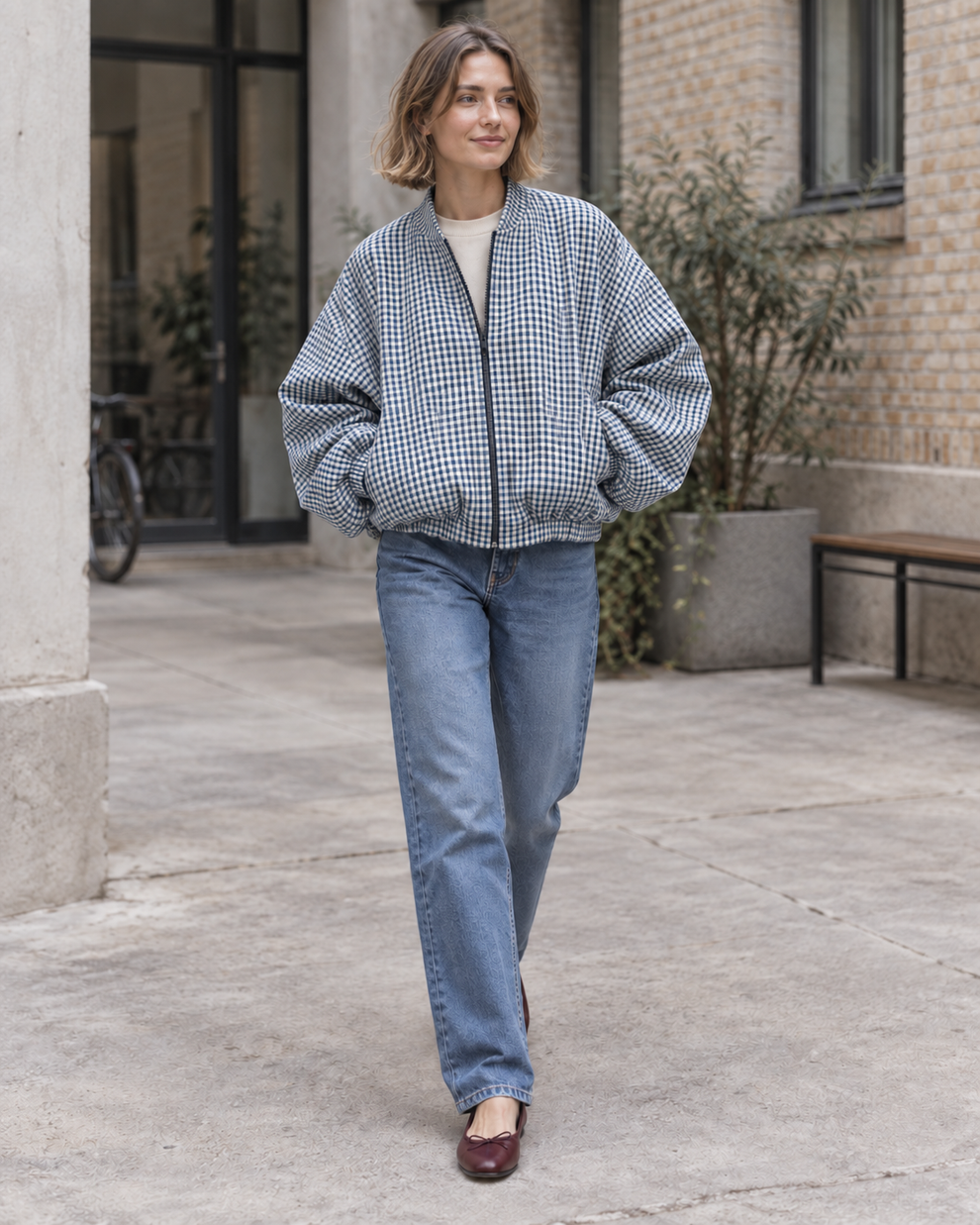 Woman wearing the blue check colour of Checked Oversized Bomber Jacket