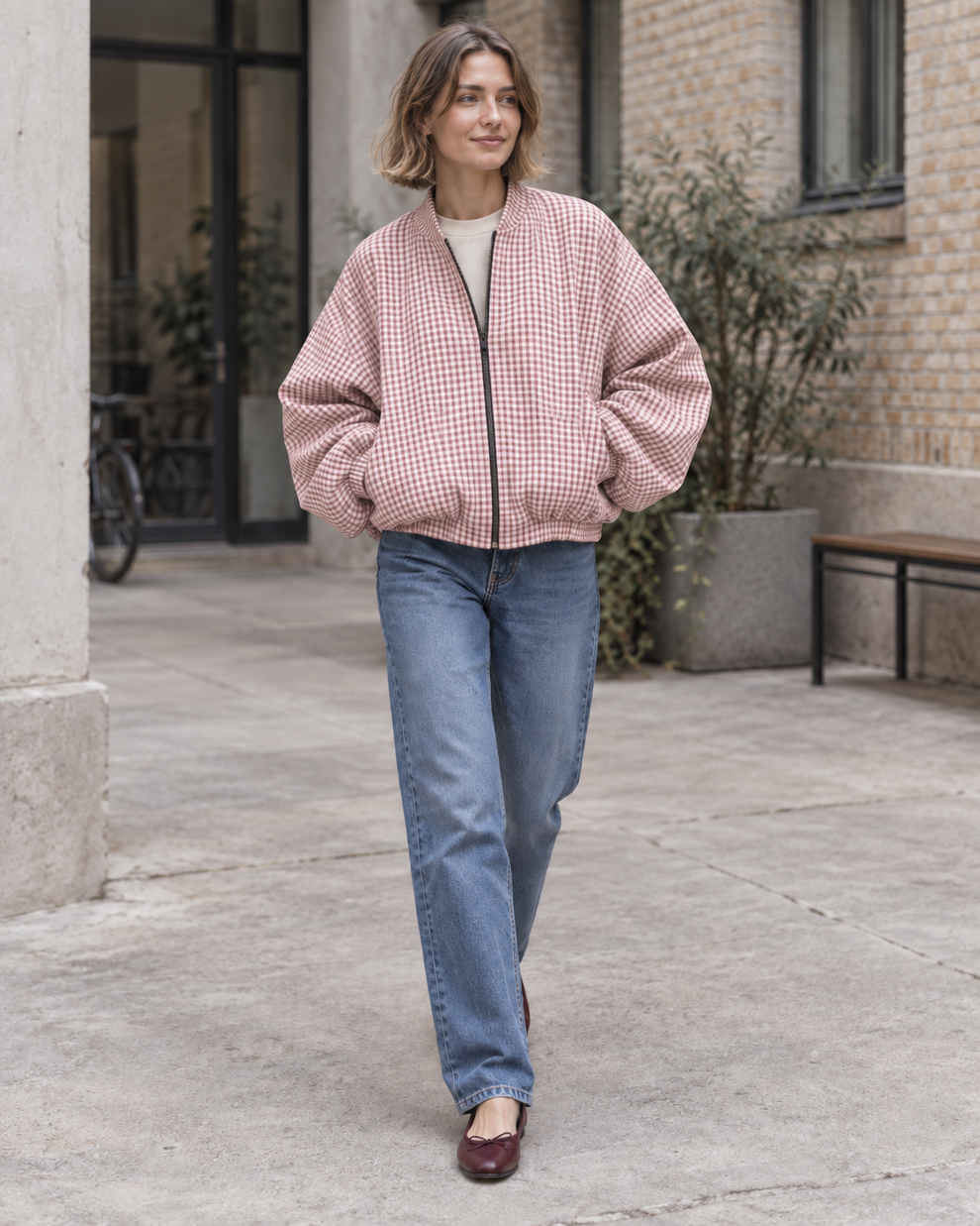 Woman wearing the pink check colour of Checked Oversized Bomber Jacket