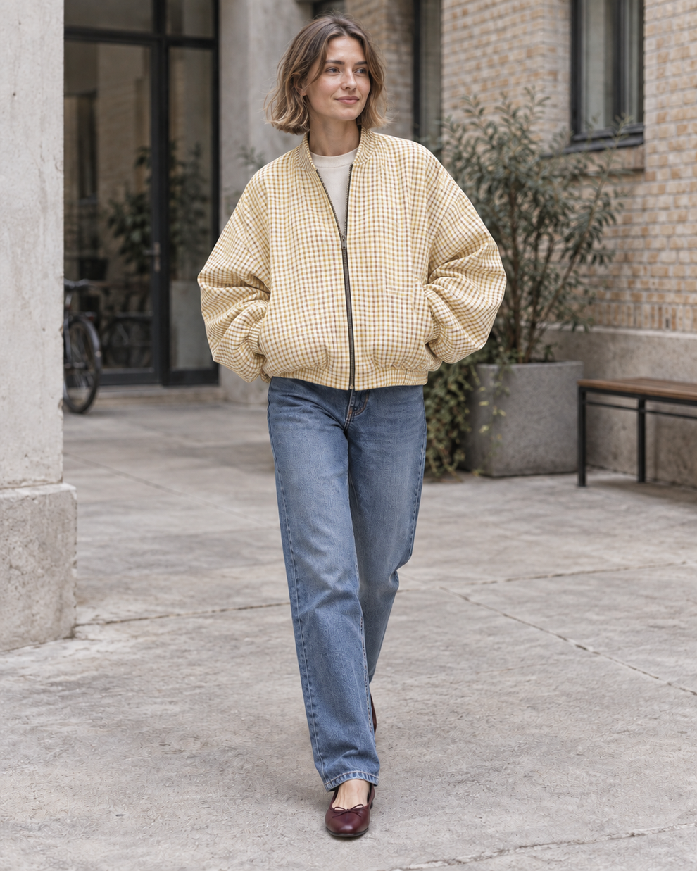 Woman wearing the yellow check colour of Checked Oversized Bomber Jacket